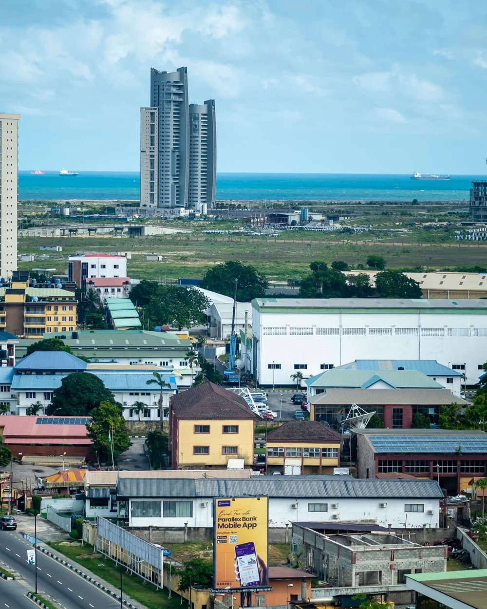 Lagos from above — high-rises along the Atlantic, the city spreading out below.